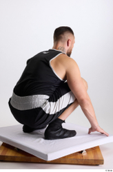 Whole Body Man White Sports Shorts Slim Athletic Kneeling Top Studio photo references